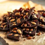 chocolate bark with a mix of toppings like chopped nuts and sea salt.